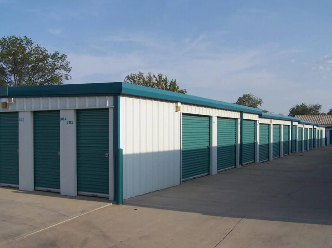 American Steel Buildings - Storage Unit Building with Green Trim and Green Doors